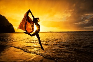 woman_jumping_silhouette_beach_iStock_23130482